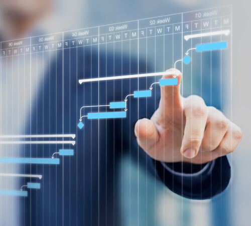 Project manager updating Gantt chart planning on a virtual screen