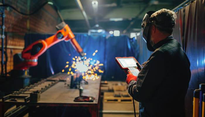 An engineer working with robot AI