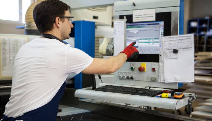 Shop floor employee using an ERP built for manufacturers