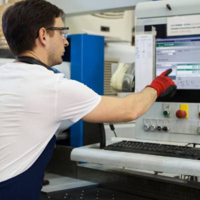 A manufacturer operating a machine